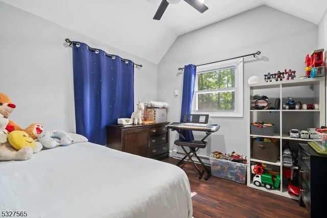 bedroom featuring ceiling fan, dark hardwood / wood-style flooring, and lofted ceiling