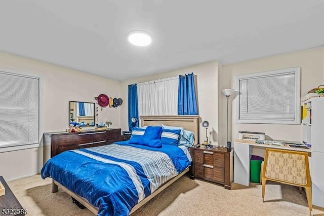 bedroom with light colored carpet