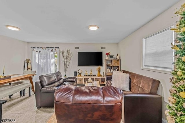 living room featuring light tile patterned flooring