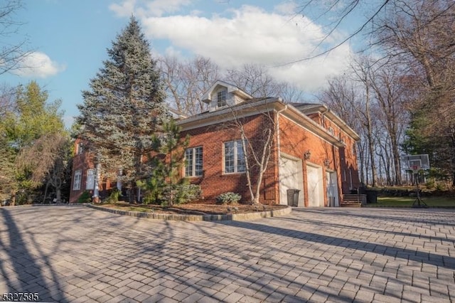 view of side of home featuring a garage