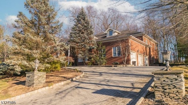 view of front of property with a garage