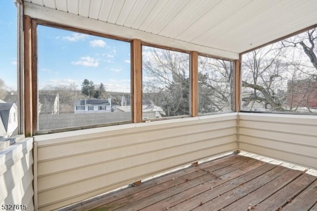 unfurnished sunroom with a wealth of natural light