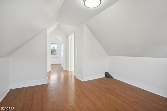 bonus room featuring wood-type flooring and lofted ceiling