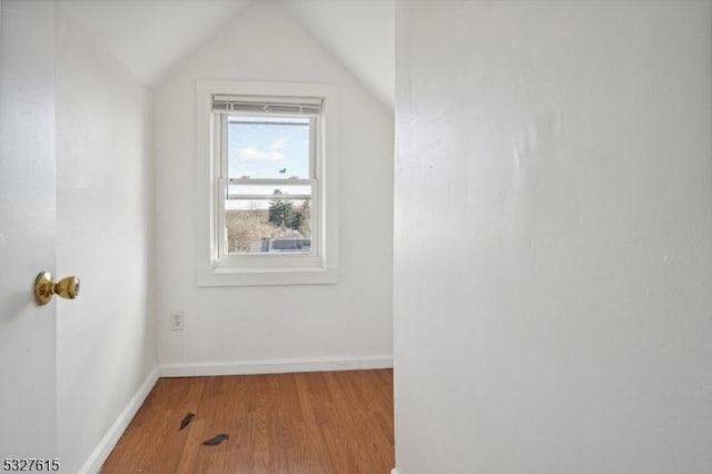 bonus room featuring hardwood / wood-style flooring and vaulted ceiling