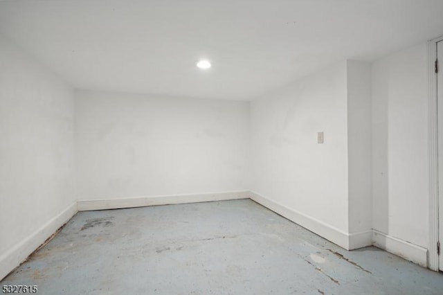 unfurnished room featuring concrete flooring