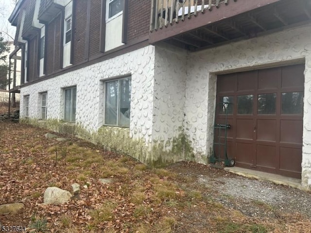 view of side of home featuring a garage