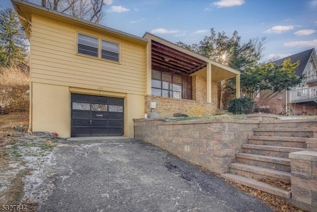 view of side of home with a garage