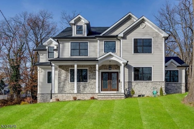 view of front of home featuring french doors and a front lawn