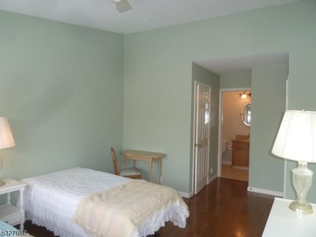 bedroom featuring dark hardwood / wood-style flooring and ceiling fan