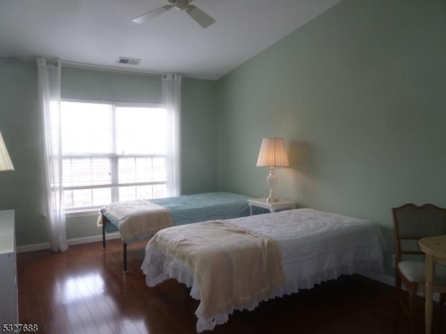 bedroom featuring dark hardwood / wood-style floors and ceiling fan