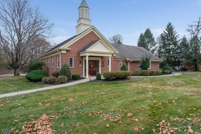 view of front of home with a front yard