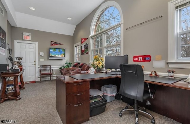 office space featuring lofted ceiling and light carpet