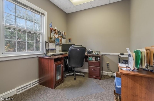 office space with a drop ceiling and light carpet