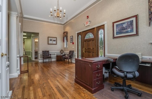 office area featuring an inviting chandelier, ornamental molding, and hardwood / wood-style flooring