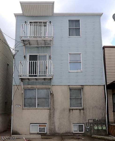 rear view of house with a balcony