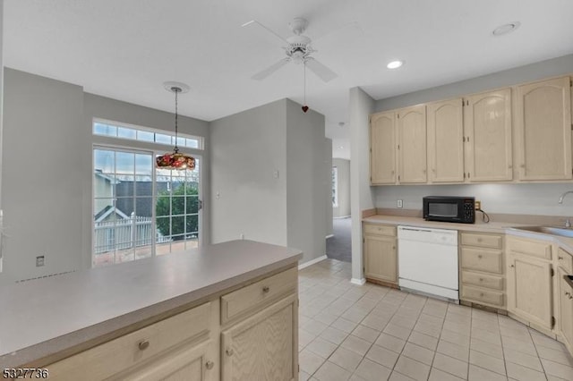 kitchen featuring ceiling fan, dishwasher, sink, pendant lighting, and light tile patterned floors