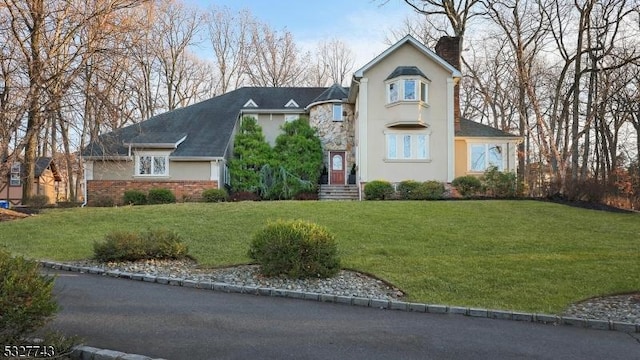 view of front of home with a front yard