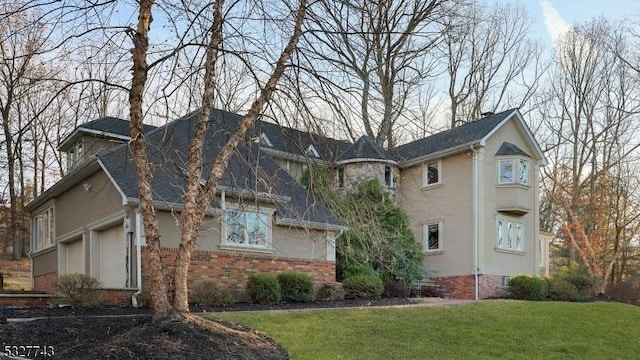 exterior space with a lawn and a garage