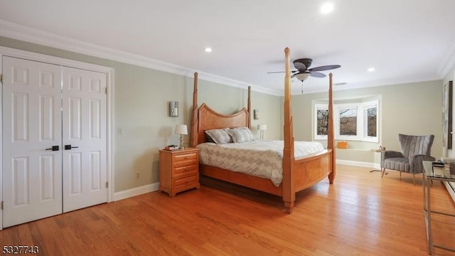 bedroom with ceiling fan, crown molding, and light hardwood / wood-style flooring