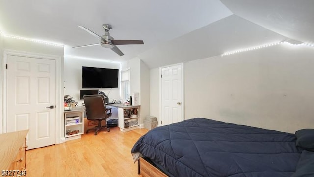 bedroom featuring lofted ceiling, ceiling fan, and light hardwood / wood-style floors