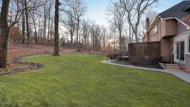 view of yard featuring a deck