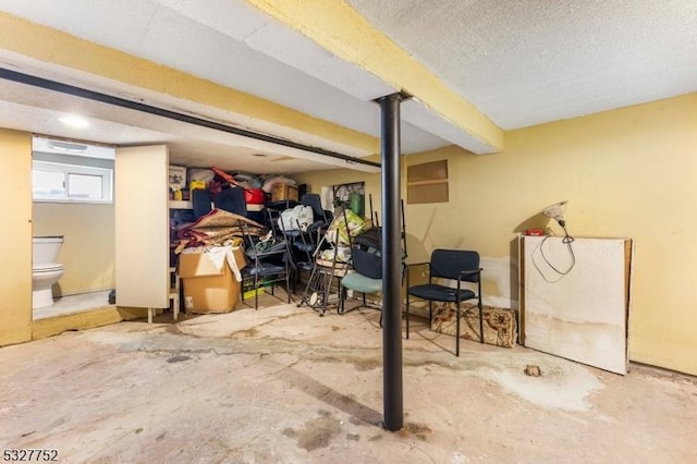 basement featuring a textured ceiling