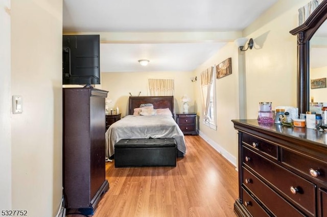 bedroom with light wood-type flooring