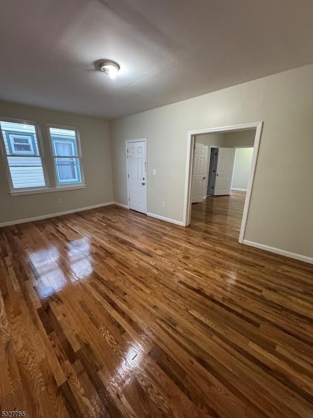 spare room featuring dark hardwood / wood-style floors