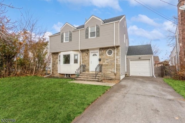 view of front of home featuring a front yard and a garage