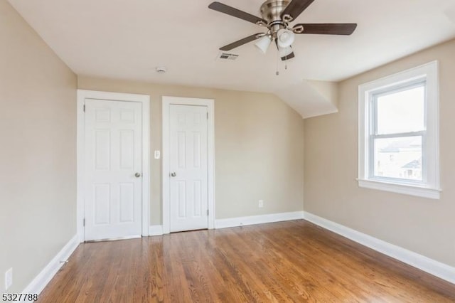 additional living space featuring ceiling fan and hardwood / wood-style flooring