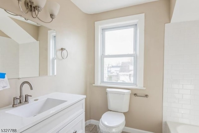 bathroom with tile patterned floors, vanity, and toilet