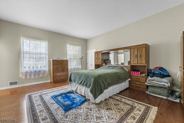 bedroom featuring dark wood-type flooring