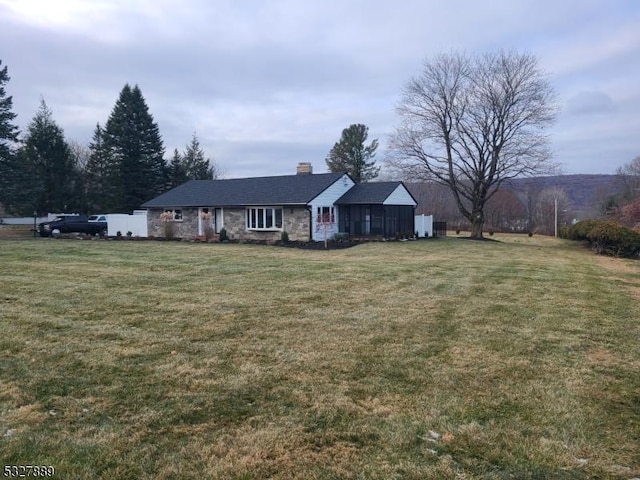 ranch-style home featuring a front yard