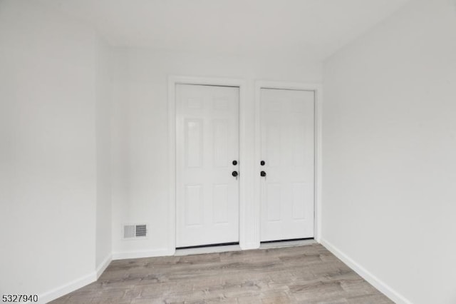 empty room with light wood-type flooring