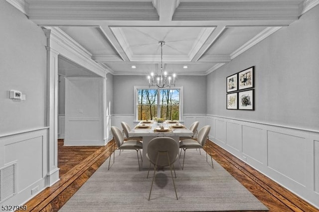 dining room with beam ceiling, light hardwood / wood-style flooring, crown molding, and coffered ceiling