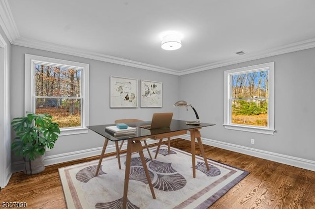 home office featuring wood-type flooring and ornamental molding