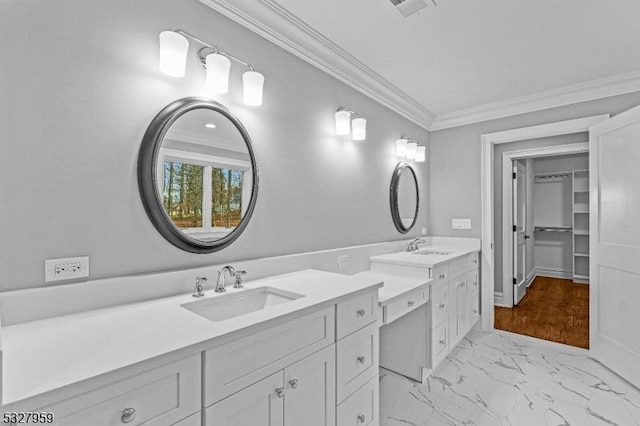 bathroom featuring vanity and ornamental molding