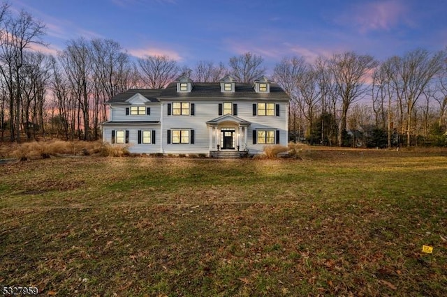 view of front of property with a yard