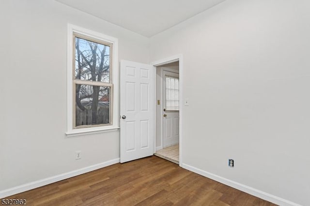 empty room with wood-type flooring