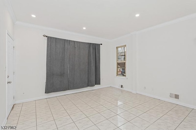 tiled empty room featuring crown molding