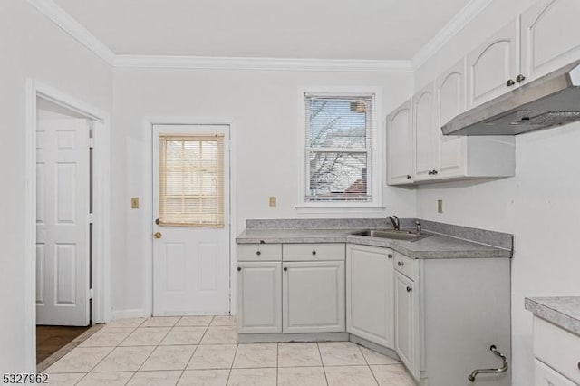 kitchen with white cabinets, a healthy amount of sunlight, and sink