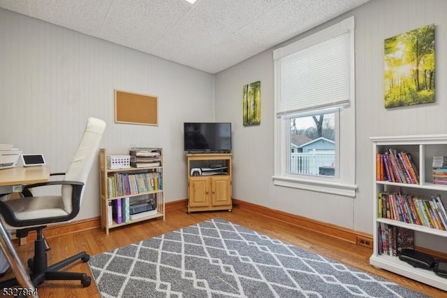 office space with wood-type flooring