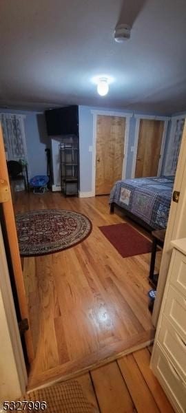 bedroom with hardwood / wood-style floors