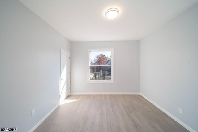 spare room featuring light hardwood / wood-style flooring