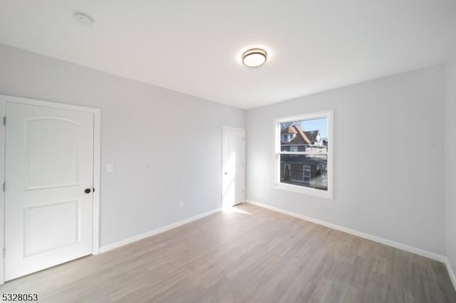 unfurnished room featuring light hardwood / wood-style floors