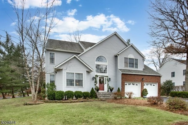 view of property with a garage and a front yard