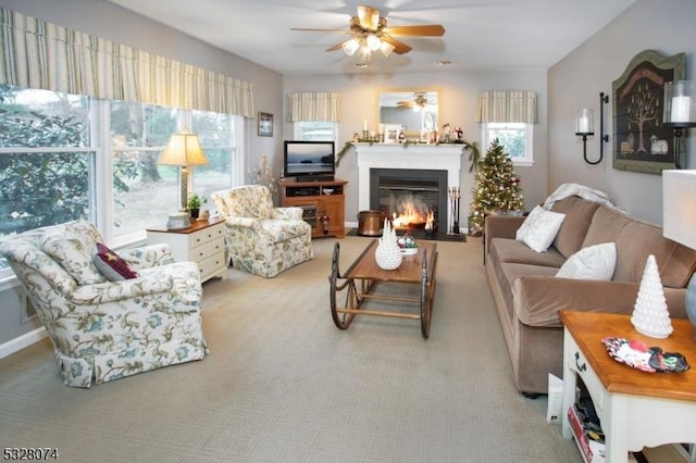 living room featuring light carpet and ceiling fan