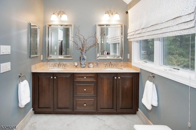 bathroom with vanity and vaulted ceiling