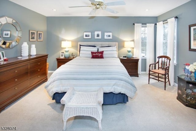 carpeted bedroom featuring ceiling fan