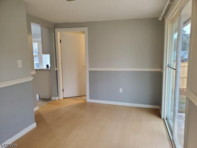 unfurnished room featuring light wood-type flooring